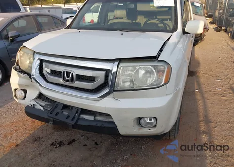 2011 Honda Pilot Touring z USA, uszkodzony, nr VIN 5FNYF4H9XBB095599